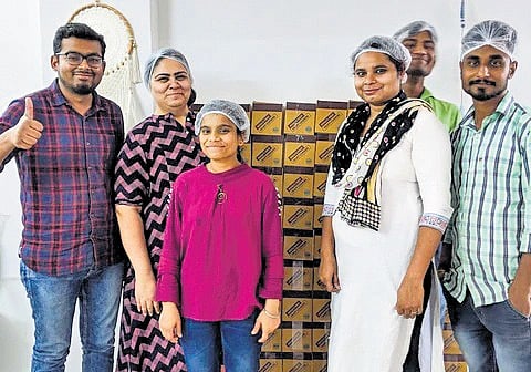 (Left) Chaman Raj and Arushi Sachdeva with their team