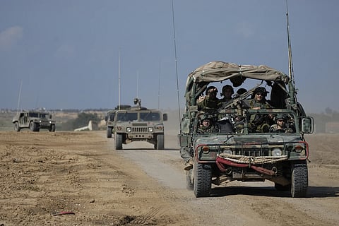 Israeli forces move near the Gaza Strip border in Southern Israel, Thursday, Jan 25, 2024.