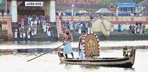 The idol of Sree Rama being taken across the river Triprayar for Arattupuzha Pooram.