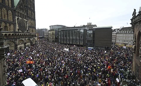 Thousands gather to demonstrate against right-wing extremism. in the market square in Bremen, Germany, Sunday, Jan 21, 2024.
