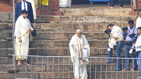 Modi offering food to fish at Triprayar Sree Rama temple.