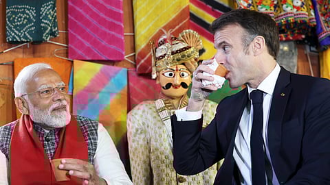 Prime Minister Narendra Modi and French President Emmanuel Macron drink tea at market, in Jaipur, Thursday, Jan. 25, 2024.