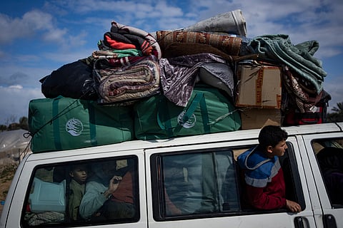 Palestinians arrive in the southern Gaza town of Rafah after fleeing an Israeli ground and air offensive in the nearby city of Khan Younis.