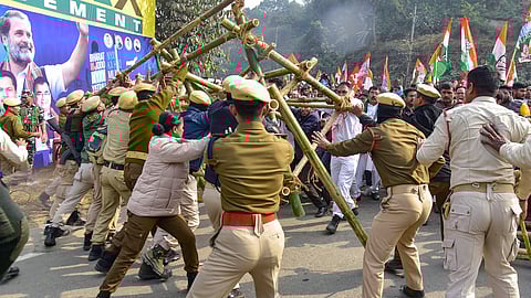 Security personnel attempt to stop Congress workers from crossing police barricades during the latter's Bharat Jodo Nyay Yatra, in Guwahati