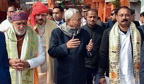 Bihar CM Nitish Kumar (C) along with Union Minister Ashwini Choubey (L) after offering prayers at the Brahmeshwarnath Temple in Buxar on Saturday.