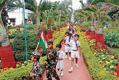School children holding the Tri-colour at the Netaji Birth Place Museum park in Cuttack on Tuesday.