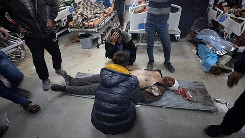 Injured people receive treatment in Gaza City's Al-Shifa hospital, following a reported Israeli strike, that according to Gaza's Health Ministry, killed at least 20 and wounded more than 150 as they waited for humanitarian aid, on January 25, 2024, amid ongoing battles between Israel and Hamas.