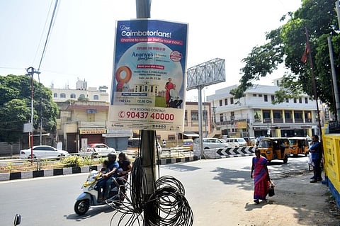 Advertisers fixed the advertisement board on TANGEDCO poles in Coimbatore on Friday.