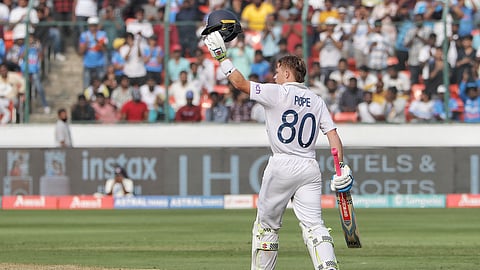 England's Ollie Pope celebrates after scoring a century during the third day of the first Test cricket match between India and England at the Rajiv Gandhi International Stadium in Hyderabad. 