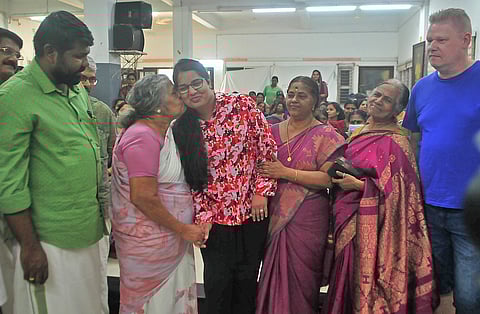 Santhamma, former caretaker at the Kerala State Council for Child Welfare (KSCCW), kisses Maya (now Carolina Osberg), who paid a visit to the council after 30 years, as other caretakers Jayakumari and Girija Devi look on. KSCCW general secretary G L Arun Gopi (left) and Caroline’s husband Patrick are also seen.