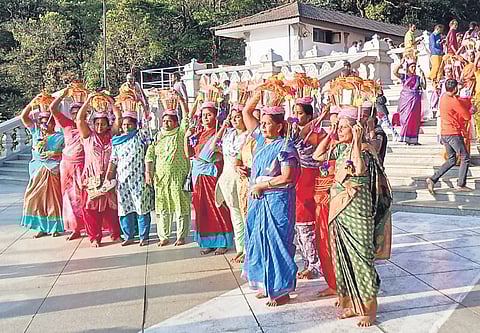he women devotees carried the water in pots, which will be transported to the temple in TN. 