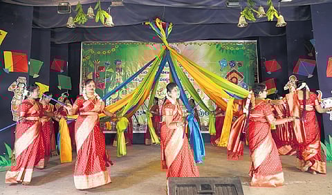 Women members of Telugu community performing at Prakasham hall on Sunday.
