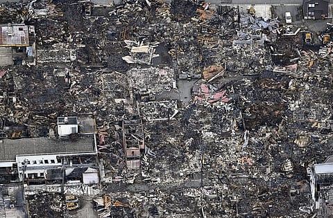 This aerial photo shows the burnt-out marketplace known as Wajima morning market, following a large fire caused by the earthquakes, in Wajima, Ishikawa prefecture, Japan Thursday, Jan. 4, 2024.
