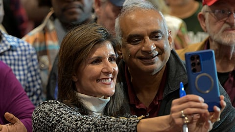Republican presidential candidate Nikki Haley, left, takes a selfie with an attendee at a campaign event in Conway, S.C., on Jan. 28, 2024.