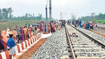 Villagers gather at the accident site on Thursday morning.