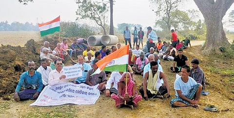 Villagers on dharna protesting boundary wall construction by IDCO..