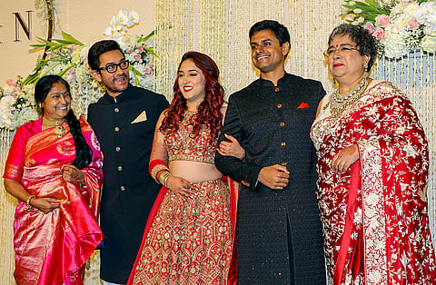 Actor Aamir Khan with film producer Reena Dutta and others poses for photos during the wedding reception ceremony of his daughter Ira Khan and Nupur Shikhare, in Mumbai.