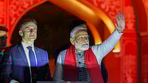 Prime Minister Narendra Modi and French President Emmanuel Macron during a roadshow in Jaipur on Thursday, January 25, 2024.