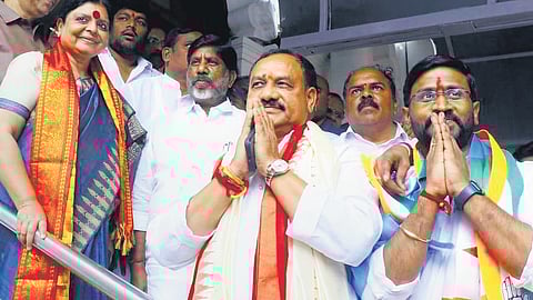 Congress candidates Mahesh Kumar Goud and Balmoor Venkat greet party workers and leaders after filing their nomination papers on Thursday
