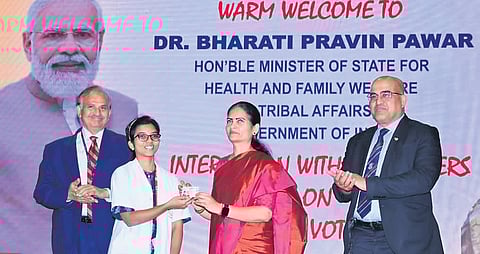 Bharati Pawar distributing voter ID cards at AIIMS Mangalagiri I Express