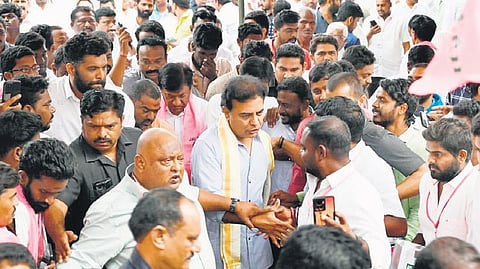 BRS working president KT Rama Rao greets party workers during a meeting in Karimnagar on Wednesday