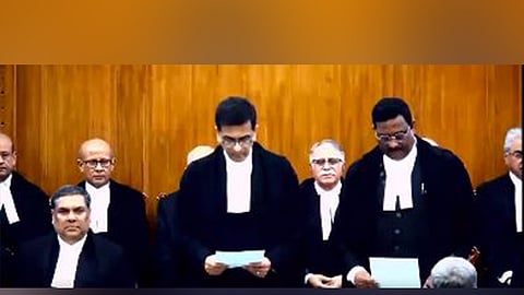 Justice D.Y. Chandrachud administers the oath of office to Justice Prasanna B. Varale as a judge of the Supreme Court. 