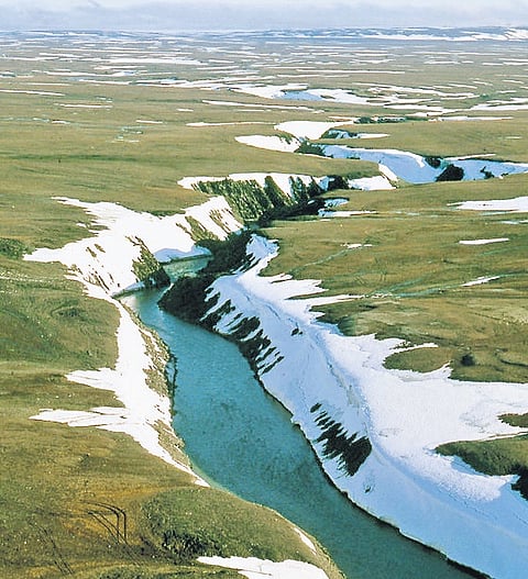 The layers of crust reveal themselves as the permafrost
thaws, owing to changing climate