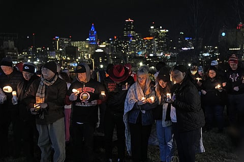 People attend a candlelight vigil for victims of shooting at Kansas City Chiefs Super Bowl victory rally, Thursday, Feb 15, 2024.