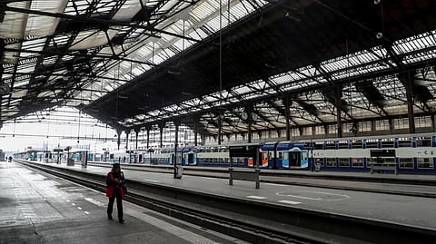 
A SNCF employee walks on an empty platform of the Gare de Lyon train station in Paris, France on April 3, 2020