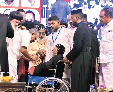 Chief Minister Pinarayi Vijayan greets Baselios Thomas I Catholicos at the venue of the golden jubilee celebration of his episcopal consecration at Puthencruz on Sunday.