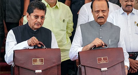 Maharashtra Dy CM Ajit Pawar along with Cabinet Minister for Ministry of Education and Ministry of Marathi Deepak Kesarkar arrives to present the State Budget 2024-25 in the Assembly, at Vidhan Bhavan, in Mumbai, Tuesday, Feb. 27, 2024.