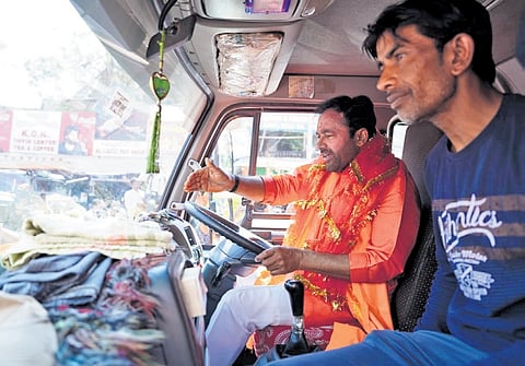 State BJP president G Kishan Reddy drives a truck after performing a special puja 
at the Bhagyalakshmi temple near Charminar in Hyderabad on Monday
