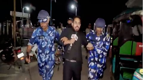 Republic TV reporter Santu Pal being dragged by the police