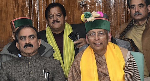 Himachal Pradesh Chief Minister Sukhvinder Singh Sukhu with Congress candidate Abhishek Manu Singhvi addresses a press conference after the later lost the election for the Rajya Sabha seat, in Shimla, Tuesday, Feb. 27, 2024. 