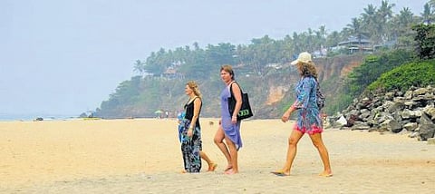 Tourists at the Varkala beach.