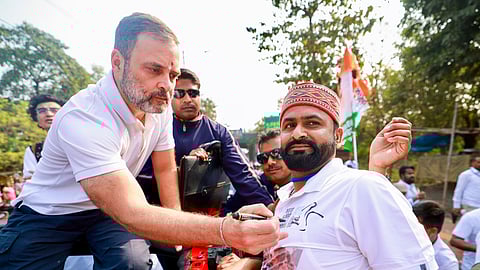 Congress leader Rahul Gandhi signs a t-shirt for a supporter during the Bharat Jodo Nyay Yatra, in Rourkela