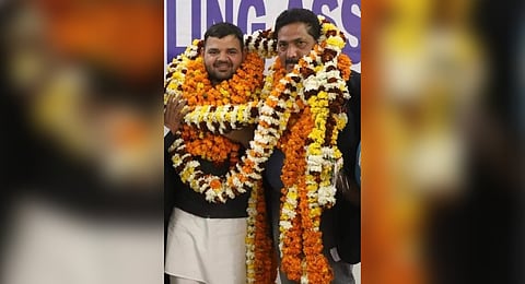 Karan Bhushan Singh (L) with Suresh Chandra Upadhyay after the elections