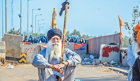 An elderly farmer participating in a ‘Black Day’ protest at the Shambhu border in Patiala district on Friday .