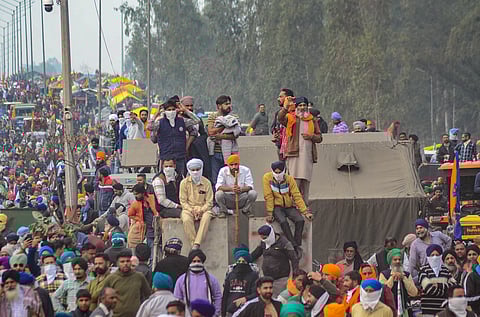 Farmers gather near Punjab-Haryana Shambhu border during their 'Delhi Chalo' march, near Patiala, Tuesday, Feb. 13, 2024.