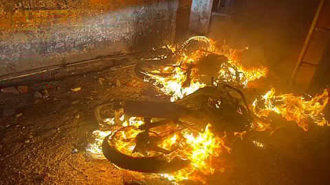Vehicles set on fire by miscreants after officials demolished a madrasa, in Haldwani, Uttarakhand on Thursday.