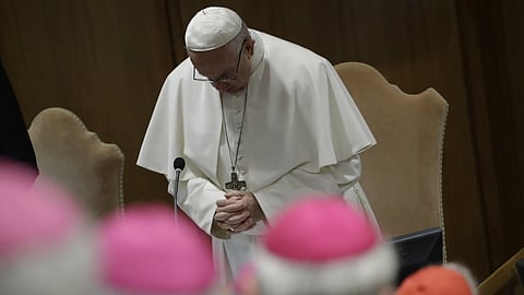 Pope Francis prays at the beginning of the third day of a Vatican's conference on dealing with sex abuse by priests, at the Vatican, Saturday, Feb 23, 2019.