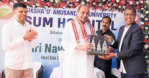 SOA founder president Prof Manojranjan Nayak presenting a memento to the CM