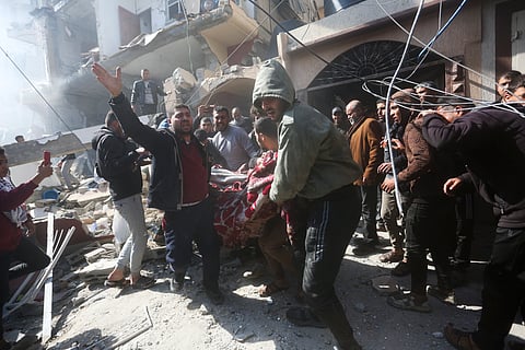 Palestinians rescue survivors after an Israeli strike on Shaheen family house in Rafah, Gaza Strip.