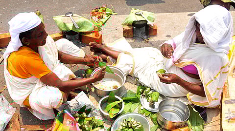 Devotees prepare pongala items for offering Attukal pongala at Overbridge juntion in Thiruvananthapuram on Sunday.
