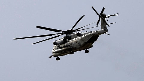A Marine Corps helicopter, like the one pictured, that had been missing with five troops aboard as an historic storm continued drenching California was found Wednesday morning