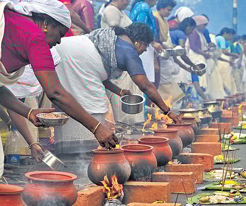 Devotees offer Attukal Pongala in Thiruvananthapuram on Sunday.