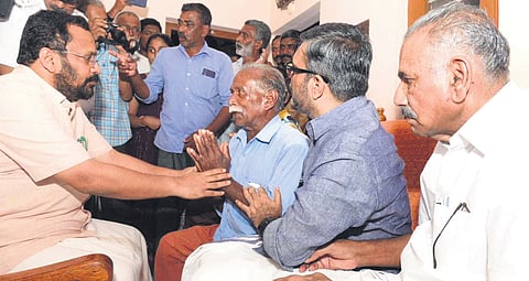 Ministers K Rajan, M B Rajesh and A K Saseendran consoling Kunjumon, father of Ajeesh who was killed by a wild elephant last week, in Wayanad on Tuesday