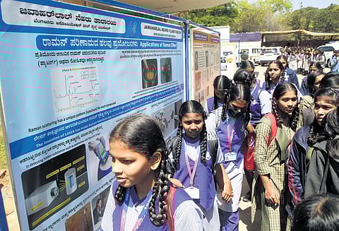 School students arrive at Jawaharlal Nehru Planetarium for the National Science Day celebrations in Bengaluru on Wednesday.