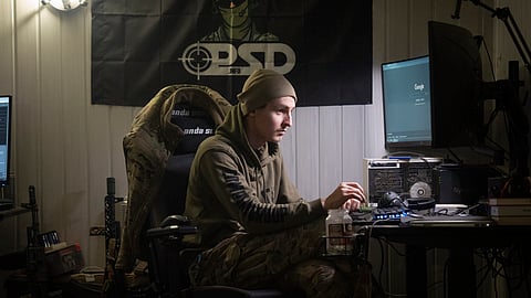 A Ukrainian officer Maksym listens to Russian chatter in a shelter near Bakhmut, Donetsk region, Ukraine, Wednesday, Jan. 24, 2024.