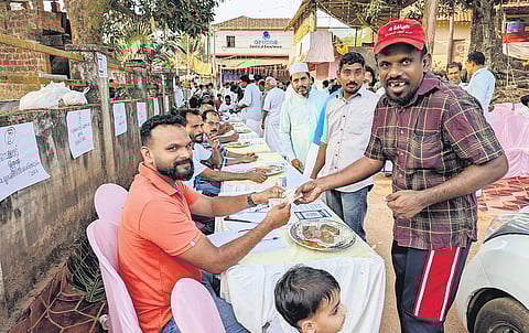 Shamim Kalangad, a specially-abled student, makes a donation during the ‘Road Kalyanam’ crowdfunding initiative on Sunday.